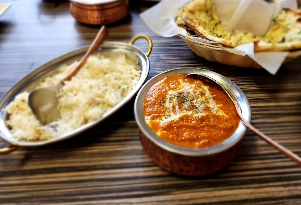 Garlic Naan with Saag Aloo and Butter Chicken
